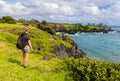 Female Hiker on The Rugged Shoreline Along The Maka Alae Coast Royalty Free Stock Photo