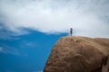 Female hiker standing on a boulder Royalty Free Stock Photo