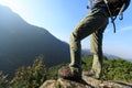 Female hiker standing on cliff Royalty Free Stock Photo