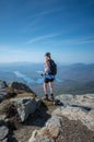 Female hiker taking photo from the trail to the summit of Whiteface Mountain Royalty Free Stock Photo