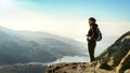 Female hiker on top of the mountain enjoying valley view Royalty Free Stock Photo