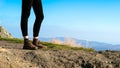 Female hiker on top of the mountain wearing hiking boots Royalty Free Stock Photo