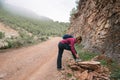 Female hiker tying her boot laces Royalty Free Stock Photo