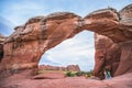 Female Hiker under Broken Arch, Arches National Park Moab Utah Royalty Free Stock Photo