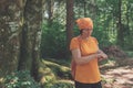 Female hiker using smart wristband during trekking in nature