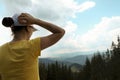 Female hiker viewing mountain landscape