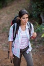 Female hiker walking in forest Royalty Free Stock Photo