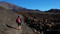 Female hiker walking the path through the volcanic landscape of Montana Samara Royalty Free Stock Photo