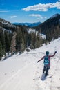 A female hiker walks down from the mountain