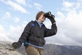 Female Hiker Watching Through Binoculars