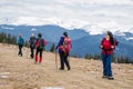 Female hikers in mountains during saffron blooming at spring