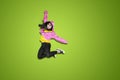 Female hip-hop dancer jumping on studio Royalty Free Stock Photo