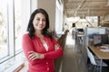 Female Hispanic architect smiling to camera in an office Royalty Free Stock Photo