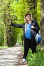 Female hitchhiker trying to catch the car