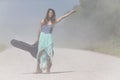 A Female Hitchhikes On A Dirt Road Royalty Free Stock Photo