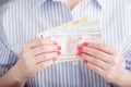 Female hold money in hands Royalty Free Stock Photo