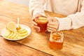 Female holding a cup of hot tea with honey, lemon and ginger - home treatment Royalty Free Stock Photo