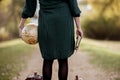 Female holding a desk globe and the bible while standing on empty pathway with blurred background Royalty Free Stock Photo