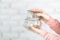 Female holding glass jar full of jelly beans Royalty Free Stock Photo