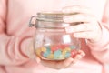 Female holding glass jar full of jelly beans Royalty Free Stock Photo