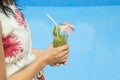 Female holding a glass of kiwi smoothie Royalty Free Stock Photo