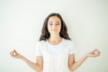 Female holding hands in namaste or prayer, eyes closed while practising yoga Royalty Free Stock Photo