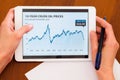 Female holding tablet with oil chart Royalty Free Stock Photo