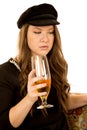 Female holding wine glass wearing black hat and dress Royalty Free Stock Photo