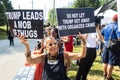 Female holds anti-Trump signs outside Atlanta Fulton County Jail