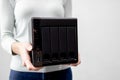 female holds small nas backup server. data backup and security concept. Royalty Free Stock Photo