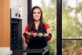 Woman Admiring her Delicious Cupcake fresh of the Oven