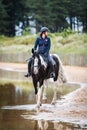 Female horse rider at Holkham National Nature Reserve