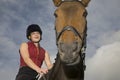 Female Horseback Rider Sitting On Horse