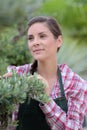 Female horticulturist at work daydreaming