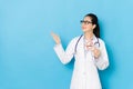 Female hospital doctor making presenting posture