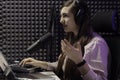 Female host broadcasting radio program Royalty Free Stock Photo