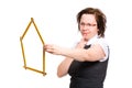 Female with house shape measure, hard decision Royalty Free Stock Photo