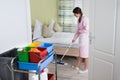 Female Housekeeper Mopping Floor