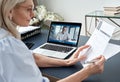 Female hr reading cv during online virtual job interview by video call. Royalty Free Stock Photo
