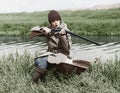 Female hunter with gun near river