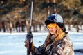 Female hunter preparing food with a portable gas burner in a win