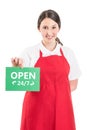 Female hypermarket worker holding open sign Royalty Free Stock Photo