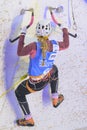Female Ice Climber Competing in UIAA Ice Climbing World Tour Using Ice Axes on Artificial Wall Royalty Free Stock Photo