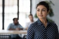 Female indian employee look in distance thinking of career opportunities Royalty Free Stock Photo