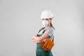 Female industrial worker in uniform on light background. Royalty Free Stock Photo