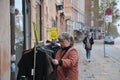 Female inspecting textile stoff and price tage in Copenhagen