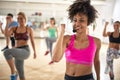 Female instructor with headset in fitness class Royalty Free Stock Photo