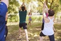 Female Instructor Leading Outdoor Yoga Class Royalty Free Stock Photo