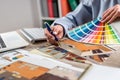 Female Interior designer work with architect plan and color palette set Royalty Free Stock Photo