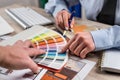 Female Interior designer work with architect plan and color palette set Royalty Free Stock Photo